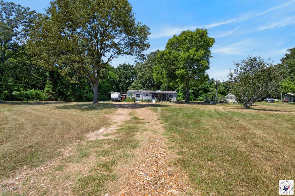 A country lane and homestead in Bowie County